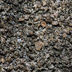 close up of a pile of stones in the ground as a background