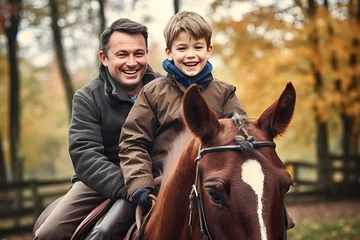 Fotobehang Portrait of father and son riding horses together in early morning © AspctStyle