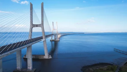 Peel and stick wall murals Vasco da Gama Bridge Aerial view of the Vasco da Gama Bridge is a cable-stayed bridge located in the city of Lisbon in Portugal and crosses the Tagus River. It is the second-longest bridge in Europe.