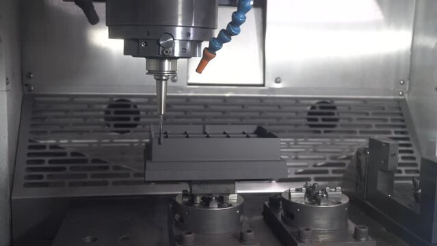 The CNC milling machine cutting the graphite electrode parts by solid ball end mill tool.