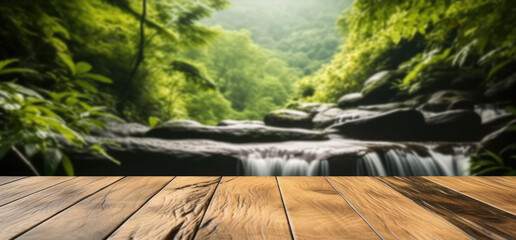 Empty wooden table top with waterfall and jungle landscape background.