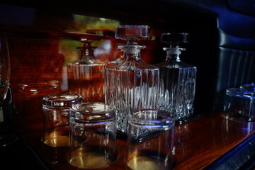 luxury whiskey glasses inside a limousine