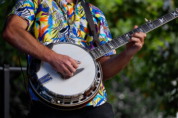 Close-up of a musician playing a banjo
