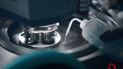 Mechanical processing of laboratory equipment. Stock footage. Liquid is poured onto laboratory...