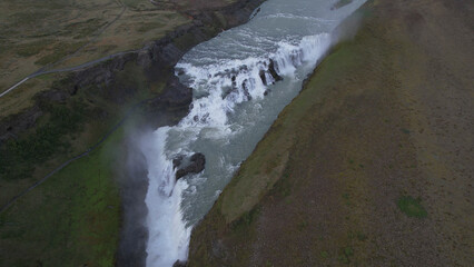 AERIAL VIEW - Gullfoss ("Golden Falls") is a waterfall located in the canyon of the Hvítá River in southwest Iceland. The rock of the river bed was formed during an interglacial period.