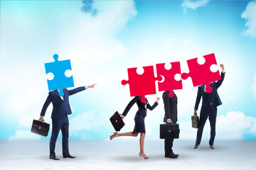 Concept of business people and jigsaw puzzle