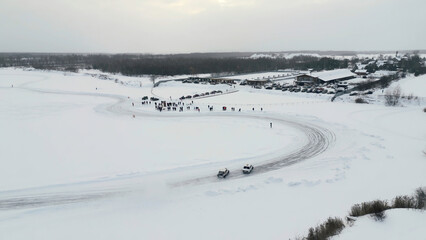 Slow motion of a racing cars championship sliding on an ice track. Clip. Winter drift competitions,...