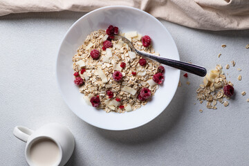 Oatmeal in a bowl with berries and coconut chips