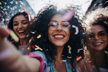 group of diverse woman surrounded by confetti celebrating and happy in daytime - obrazy, fototapety, plakaty