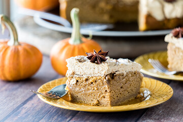 A slice of pumpkin spice latte cake with espresso frosting, ready for eating.