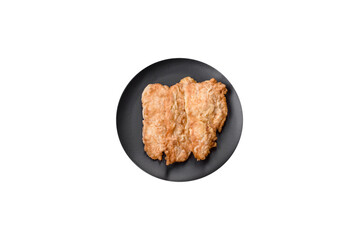 Delicious fried chicken chop or pork meat fried breaded with salt, spices and herbs