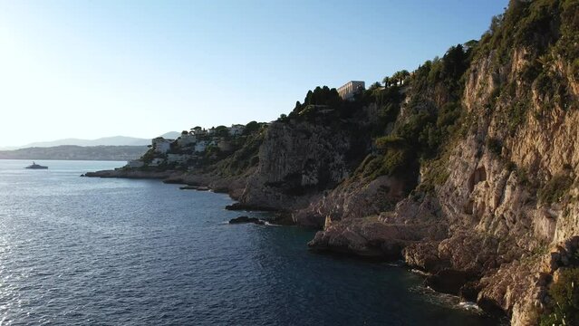 Aerial close-up view of the coastal path between Nice and Villefranche-sur-Mer and the Mediterranean Sea, France. 4k