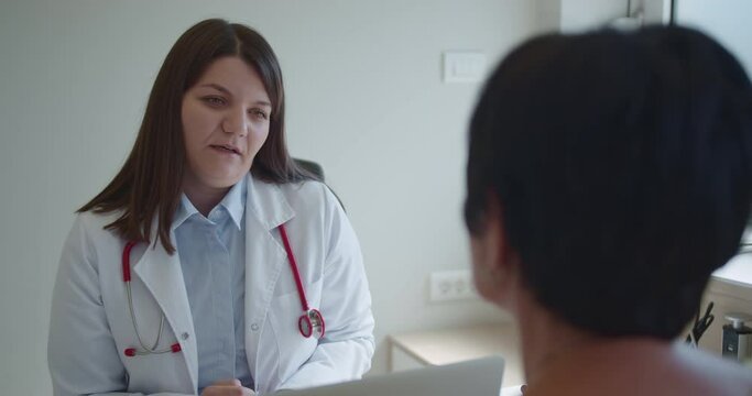 Experienced doctor being nice with elderly patient. They are talking health problems and discussing appropriate treatment or therapy.