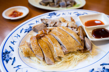 Slice of goose meat in plate at restaurant