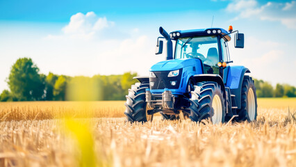 Blue modern tractor during the harvest on landscape background with clear blue sky. Agricultural machinery in foreground carrying out work in field. Copy space