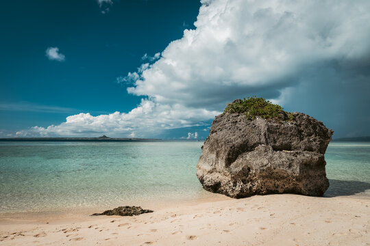 Beautiful view of tropical blue sea or ocean by the white beach and floating a cloud in summer, Okinawa in Japan, Nobody, Landscape or travel, High resolution over 50MP for wallpaper	
