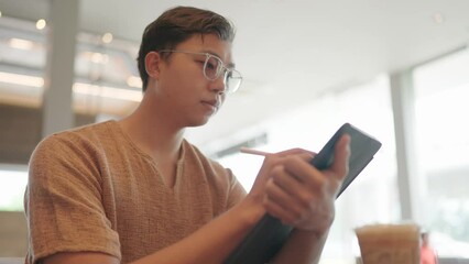 Asian freelancer co work cafe. Busy person use computer macbook coworking place. Boss man drink coffee cup. 