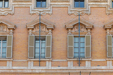 Windows on the facade of Palazzo Madama. Rome, Italy