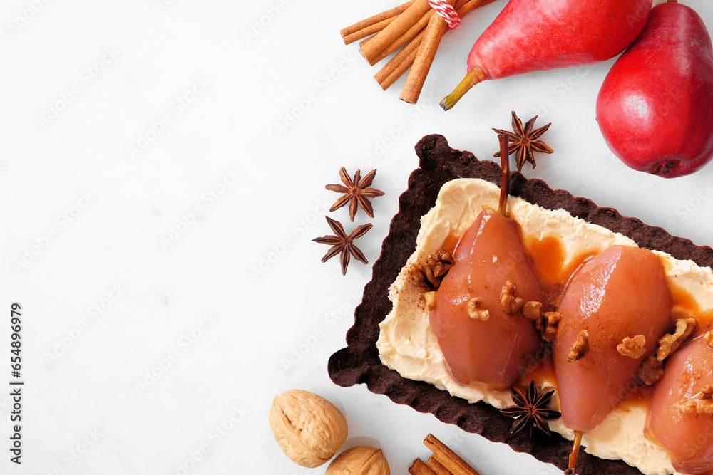 Poster spice poached pear tart. top down view side border table scene over a white marble background.