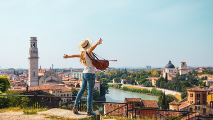 Verona, Italy- Traveler female looking at city landscape view