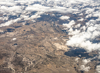 View from 10,000 meters (33,000 feet) of the mountains and arid landscape of western Peru. Dry...