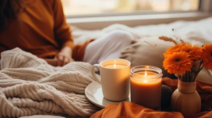  Cozy fall vibes. pumpkin spice and candles © olegganko