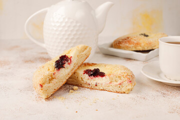 Homemade vatrushki, Russian round pastry with cottage cheese and sour cherry jam. - obrazy, fototapety, plakaty