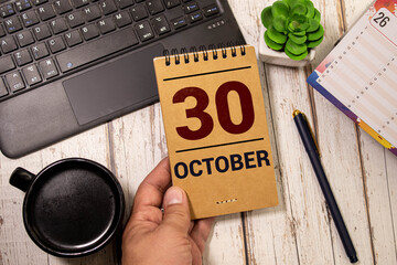 October 30 on wooden cubes on a wooden background. Autumn. Calendar for October.