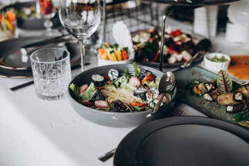 A variety of food on the table, fish, olives, bread, raspberries, meat