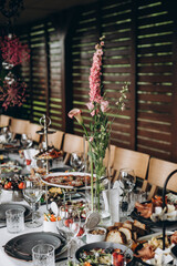 A variety of food on the table, fish, olives, bread, raspberries, meat