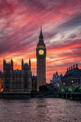 Beautiful view of the illuminated Big Ben clock tower at Westminster, London, England, during dusk with a colorful sky