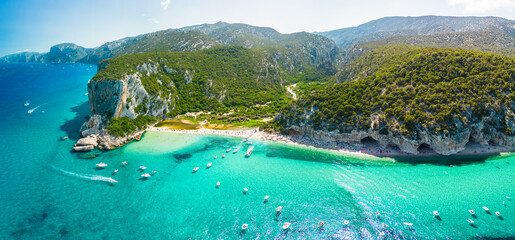 Drone view of the vibrant Cala Luna Beach on Sardinia island, Italy - 654937928