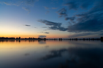 Fototapeta na wymiar Blue hour after sunset over lake constance