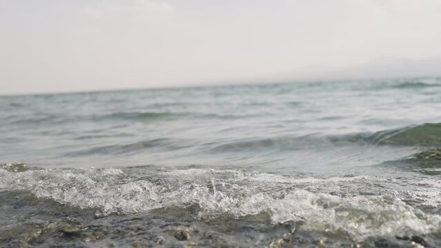Slow motion closeup shot of clear water waves of a lake