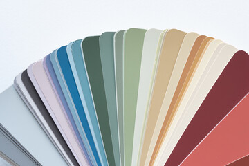 paint-chip sample book with analogous color scheme on blank paper