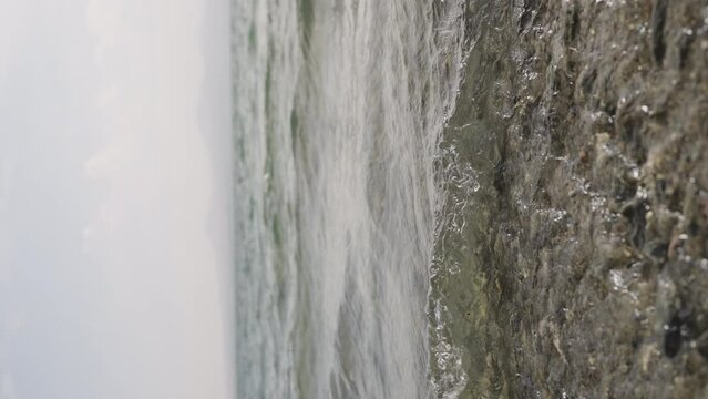 Slow motion closeup shot of clear water waves of a lake