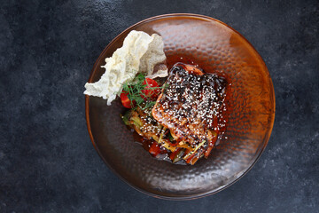 Salmon steak with kimchi sauce and wok vegetables. Vegetables with sesame seeds and teriyaki sauce. Flat lay. Top view. Copy space.Asian cuisine.