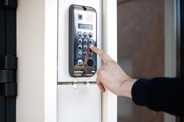 Doorphone with code near the door, entrance at the house