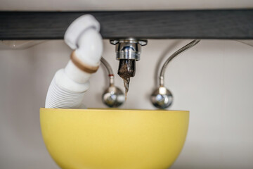 Close-up of a gelified clog obstructing the bathroom sink, highlighting the need for immediate attention to resolve the plumbing issue - obrazy, fototapety, plakaty