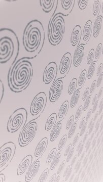 Vertical video - a repeating pattern of decorative Celtic triskele spirals moving towards the camera. This symbolic Irish styled motion background is full HD and a seamless loop.