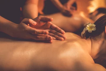 Photo sur Plexiglas Salon de massage Closeup couple customer enjoying relaxing anti-stress spa massage and pampering with beauty skin recreation leisure in warm candle lighting ambient salon spa at luxury resort or hotel. Quiescent
