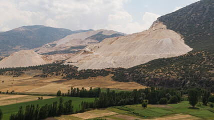 Fototapeta na wymiar Mountains destroyed by marble quarries.