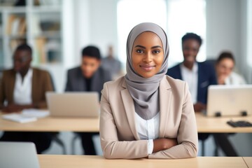 Beautiful and cheerful Arabian student in hijab attending a class at university classroom. Education concept 