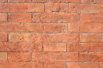 brick red wall. background of a old brick house. Seamless texture old brick wall. wall with red brick, red background.