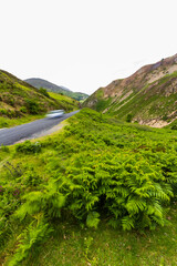 Sychnant Pass in North Wales, near Conwy, high road, car, blurred. - 654997715
