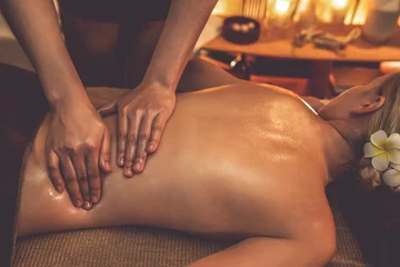 Poster Massagesalon Closeup woman customer enjoying relaxing anti-stress spa massage and pampering with beauty skin recreation leisure in warm candle lighting ambient salon spa at luxury resort or hotel. Quiescent