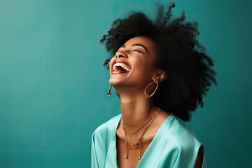 Foto op Plexiglas A joyful black woman with her mouth wide open in laughter, expressing pure happiness. © Banana Images