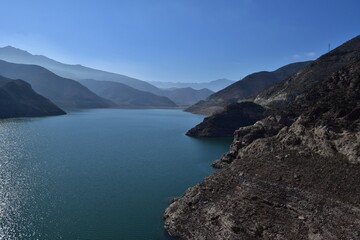 Fototapeta na wymiar Reservoir in Elqui Valley, Chile: Man-made water body amid scenic landscapes, offering irrigation, recreation, and vital water resources.
