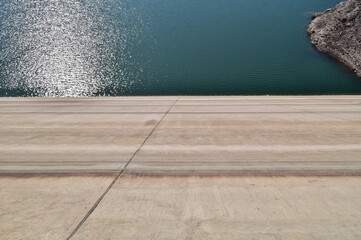Reservoir in Elqui Valley, Chile: Man-made water body amid scenic landscapes, offering irrigation, recreation, and vital water resources.