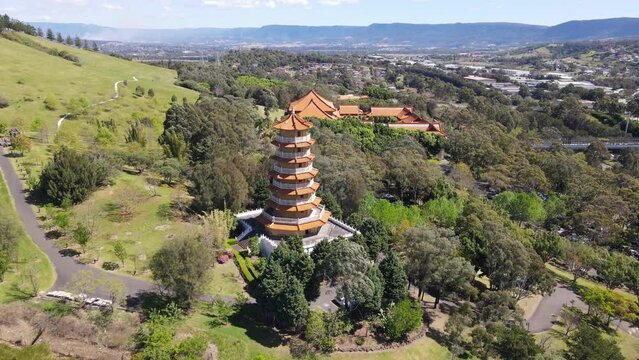 Aerial drone view of the Nan Tien Temple Buddhist complex in Berkeley, Wollongong, NSW Australia showing the pagoda on a sunny day   